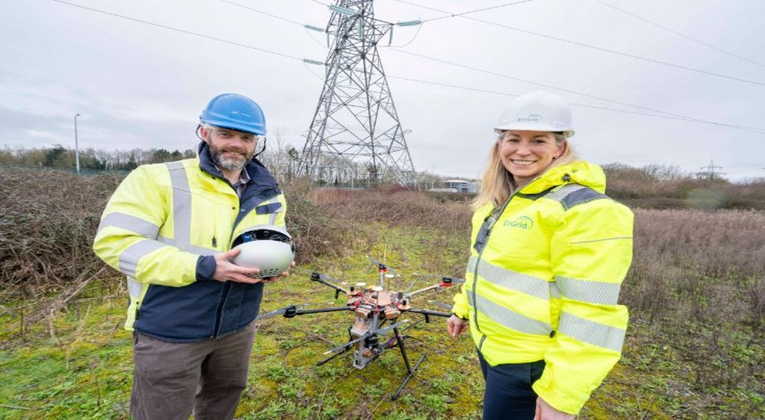 An image of two people with a drone