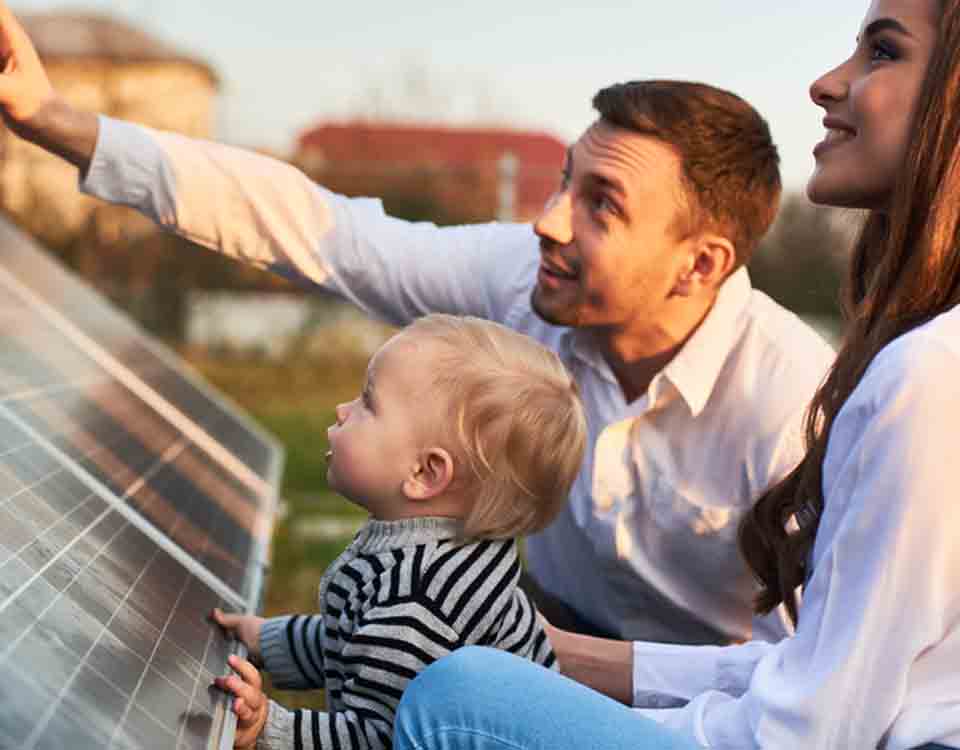 Family looking at solar panels